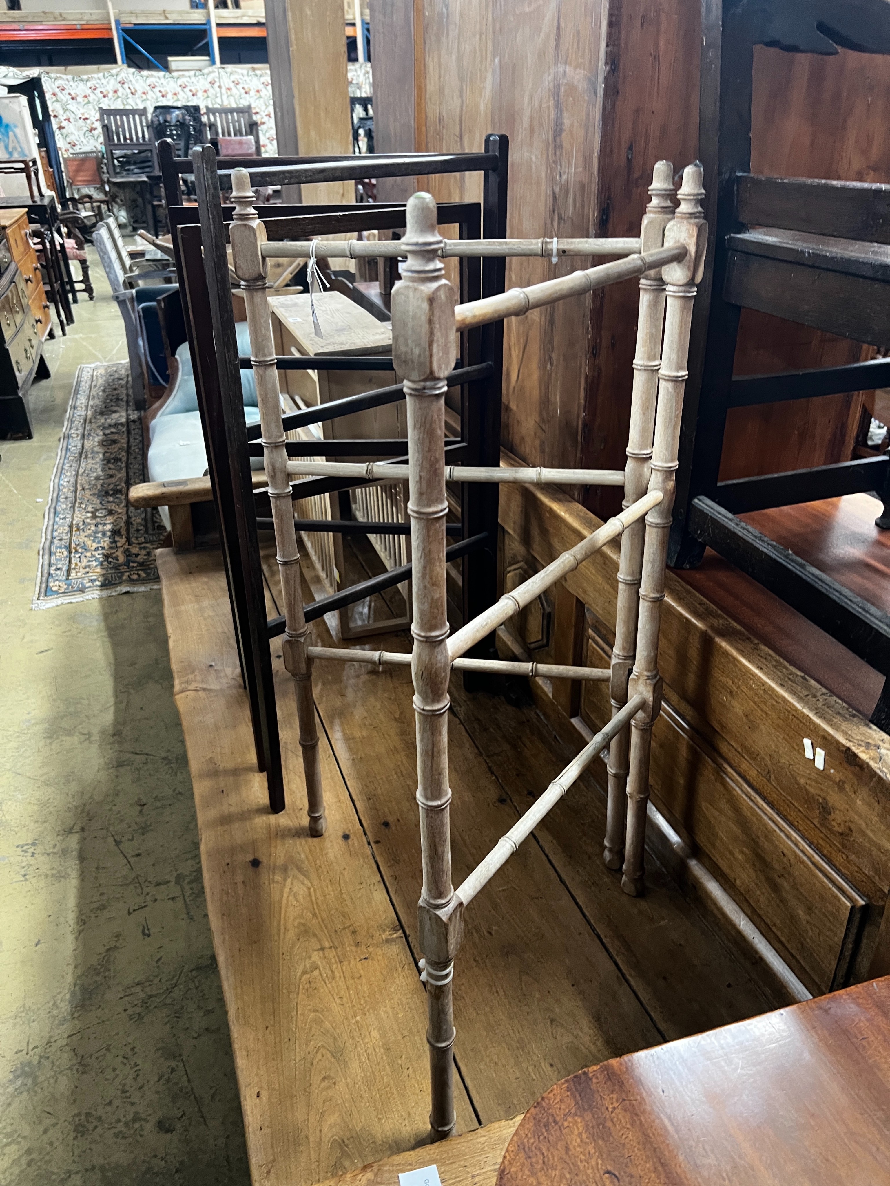 A 19th century faux bamboo folding towel rail together with two mahogany towel rails, largest height 92cm